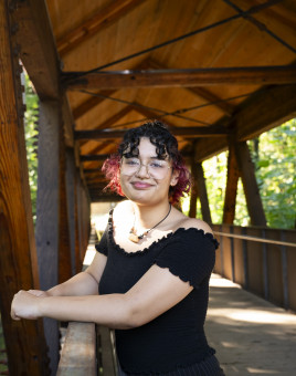 Kiana standing on the bridge smiling