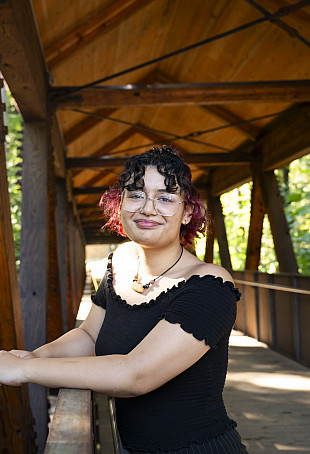 Kiana standing on the bridge smiling