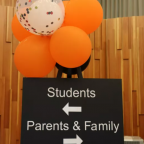 A sign providing direction to students, parents, and family members