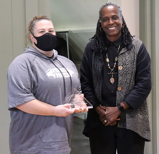 Angela Dendas-Pleasant receiving Excellence in Innovation award