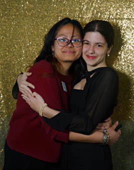 A picture of Monique and Deenie hugging for the IDEA Catalyst Awards