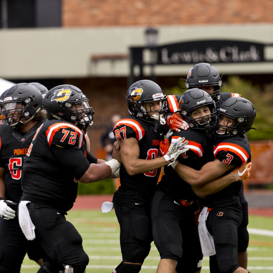 Lewis & Clark football players celebrating a touchdown.
