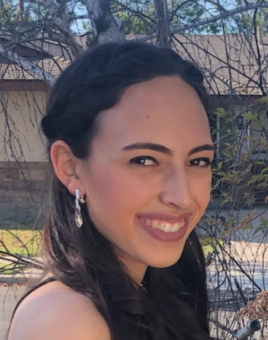 Leah smiling, turned slightly toward the camera