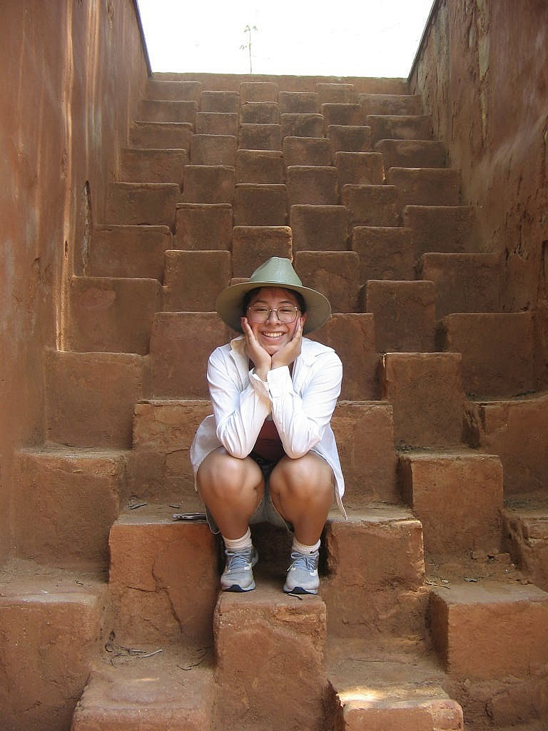 Student poses in a tiered staircase in Oaxaca, Mexico.