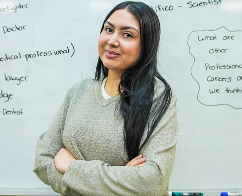 Litzy Solis-Martínez stands in front a whiteboard in the Spanish class she taught at Rosemary Anderson High School