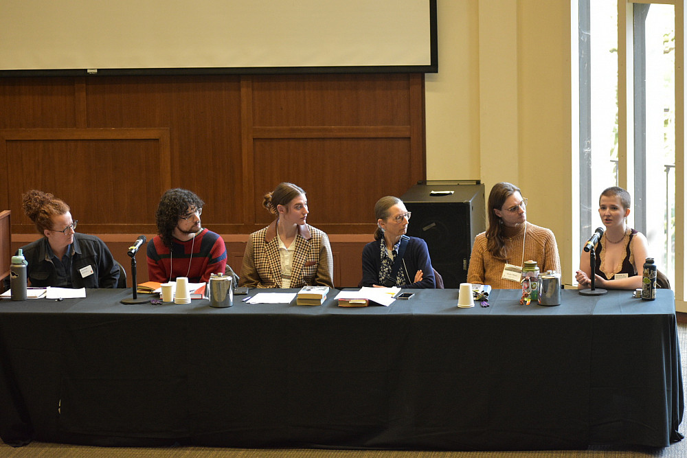 6 panelists seated at table