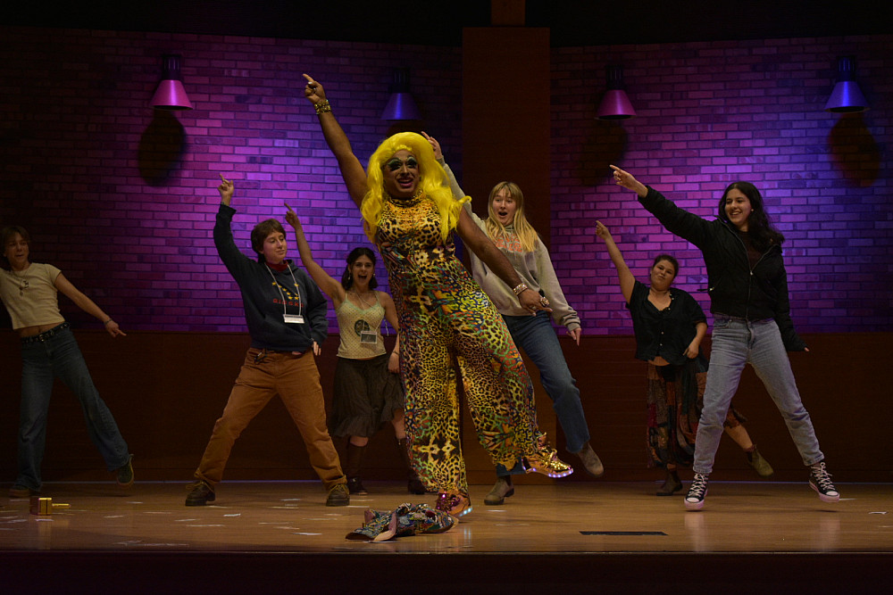 Keynote LaWhore Vagistan performing dance moves with students
