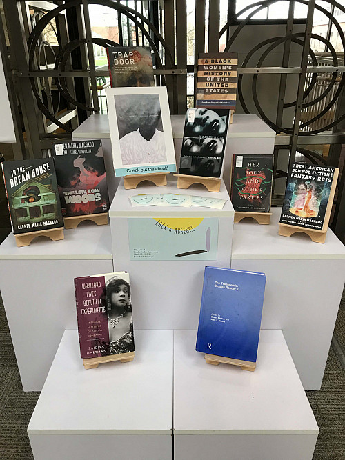 Symposium book display at Watzek Library