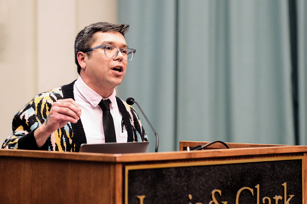 One of the Keynote presenters standing at the podium speaking