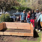 OPB article image of students around a garden bed.