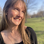 Corey looking off camera, smiling.