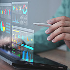 Projected digital interface showing business analytics, charts, and data dashboards.
