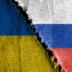 The gap between the two flags, Russia and Ukraine, as a concept of political confrontation.