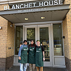 Students standing outside Blanchet House in downtown Portland.