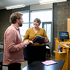 Jolina Ruckert, who teaches Psychology of Gender, talks with Story Gorge workshop leaders Kyle Glenn (left) and Sean O'Connor.