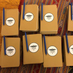 Stacks of journals for Narrative Scribe Training participants.