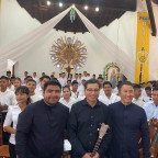 Associate Professor of Hispanic Studies Freddy Vilches and Associate Professor of Music Lance Inouye pose with the conductor of the Urubi...