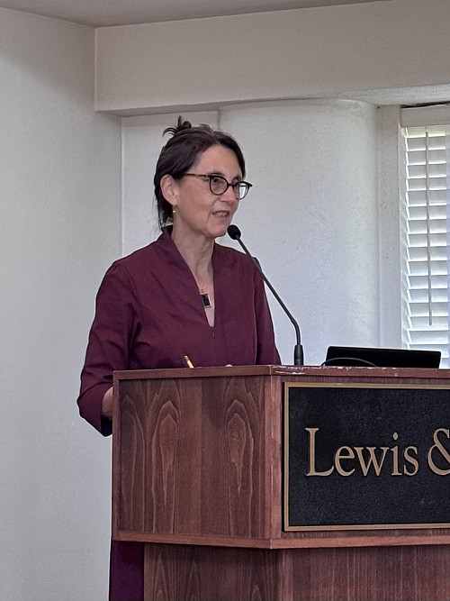 Rishona Zimring, current director of gender studies, welcomes guests to the event