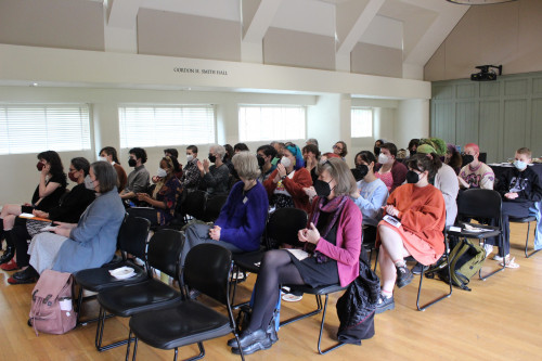 Gender studies faculty and graduating minors gather in Smith Hall to hear presentations from 2022 Dorothy Berkson writing award winners.