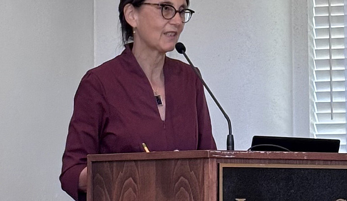 Rishona Zimring, current director of gender studies, welcomes guests to the event