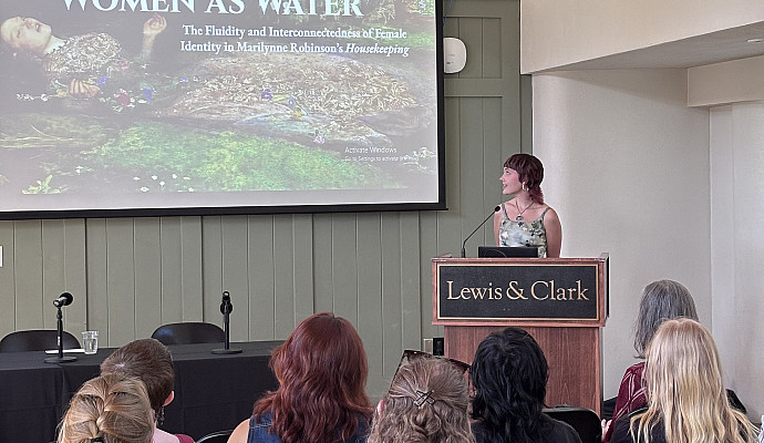 Burton Scheer '25, with the title slide for “Women as Water: The Fluidity and Interconnectedness of Female Identity in Marilyn...