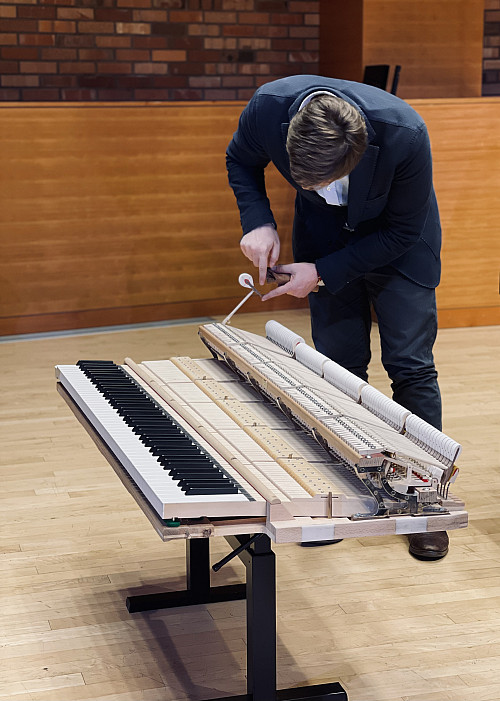 Luca inspects each hammer